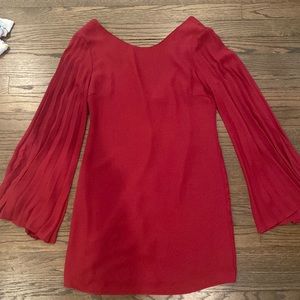 Akira Size medium red dress with flare sleeves and zipper detail in back